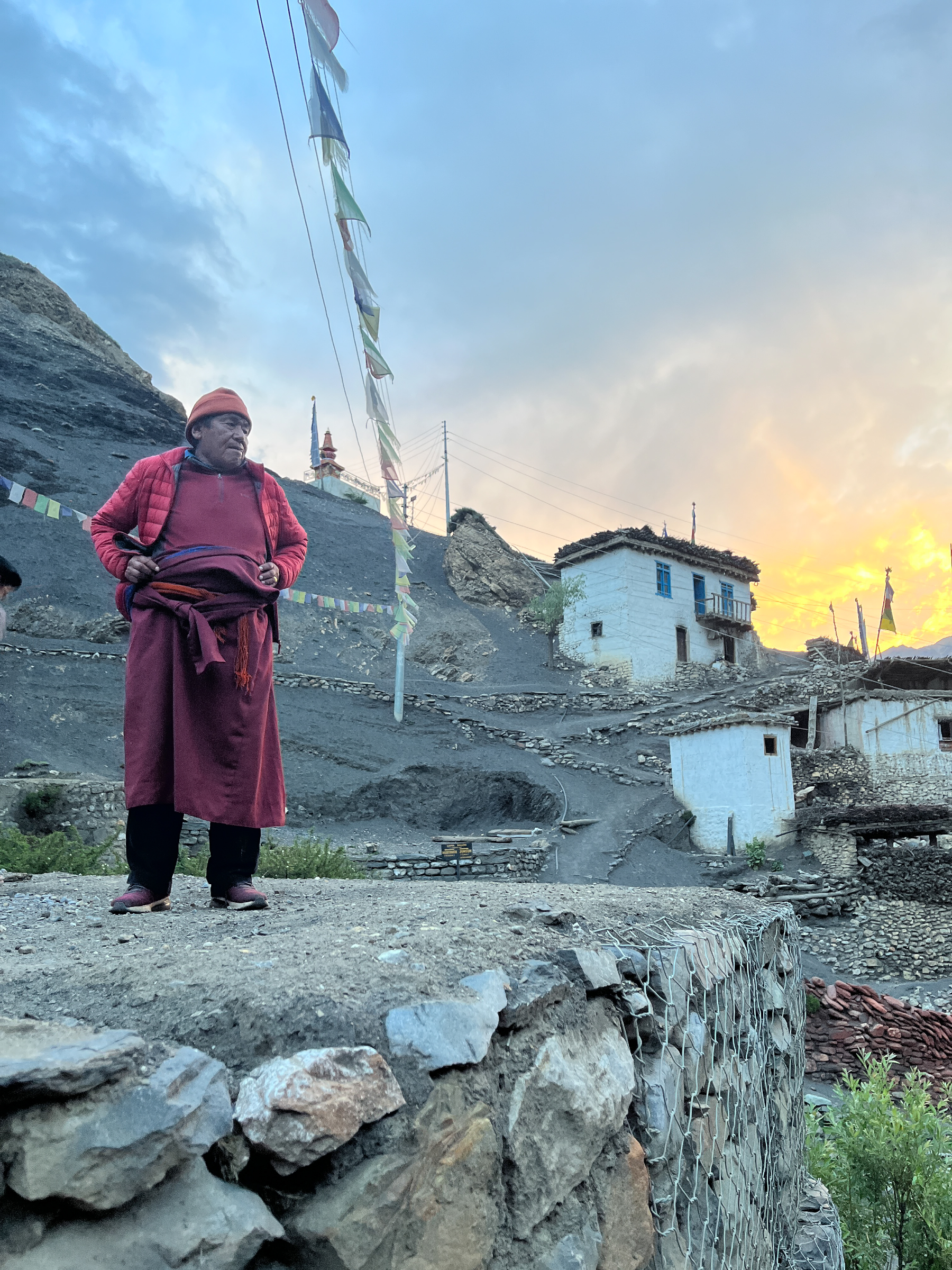 Lubra lies nestled along a flood prone tributary just a couple of kilometres from the main passage of the Kali Gandaki Corridor, an ancient trade and pilgrimage route in the Nepali Himalayas.

Lubra is one of the few villages in the world where all residents practice Bon, an animist tradition predating Tibetan Buddhism. The Lama believes road construction throughout Mustang has disturbed the mountain deities. He narrows his eyes as he speaks. "The spirits of the mountains are not happy; the building of the road is a wound upon the land." Meanwhile, reduced snowfall - in parts of Mustang it has not snowed for three years - is causing medicinal herbs to grow scarcer, disrupting the practice of traditional medicine.

The pressures of a changing climate, economic development and shifting societal norms form a complex convergence of factors with the potential to disrupt life in villages such as this. The Lama address the possibility of out migration with a simple question: "Where would we go?"